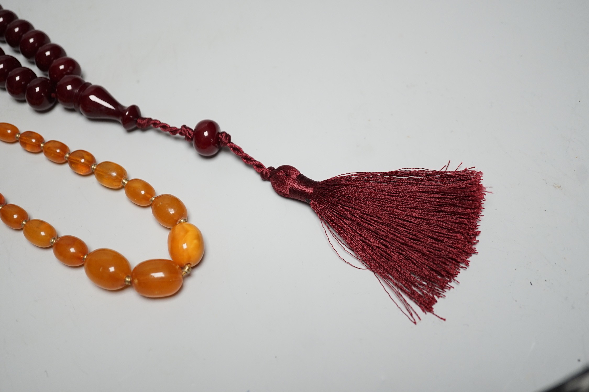 A Chinese amber and cherry amber type necklace